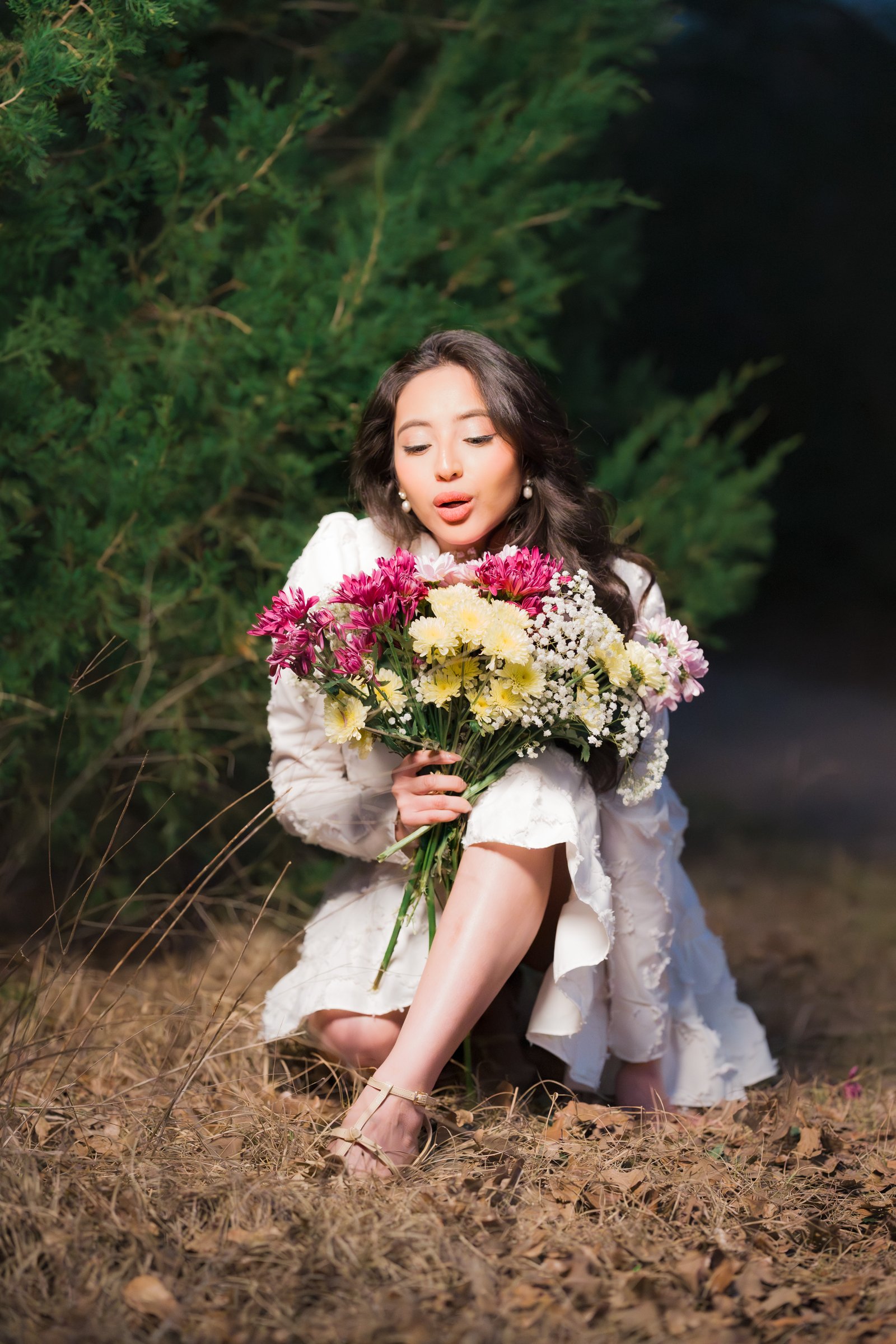 Teresa Vitela The Legacy - woman in white dress celebrating birthday with bouquet during golden hour session Texas