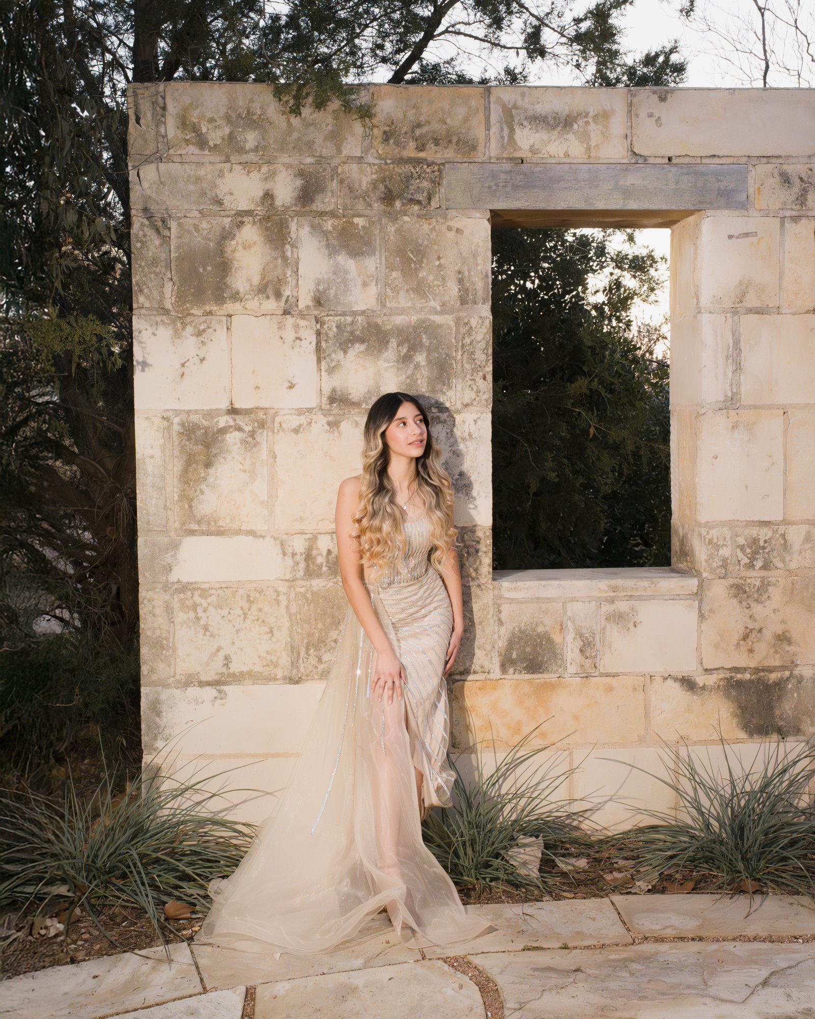 Teresa Vitela luxury senior session - magazine worthy portrait young woman beige gown on the gardens of Texas A&M College Station