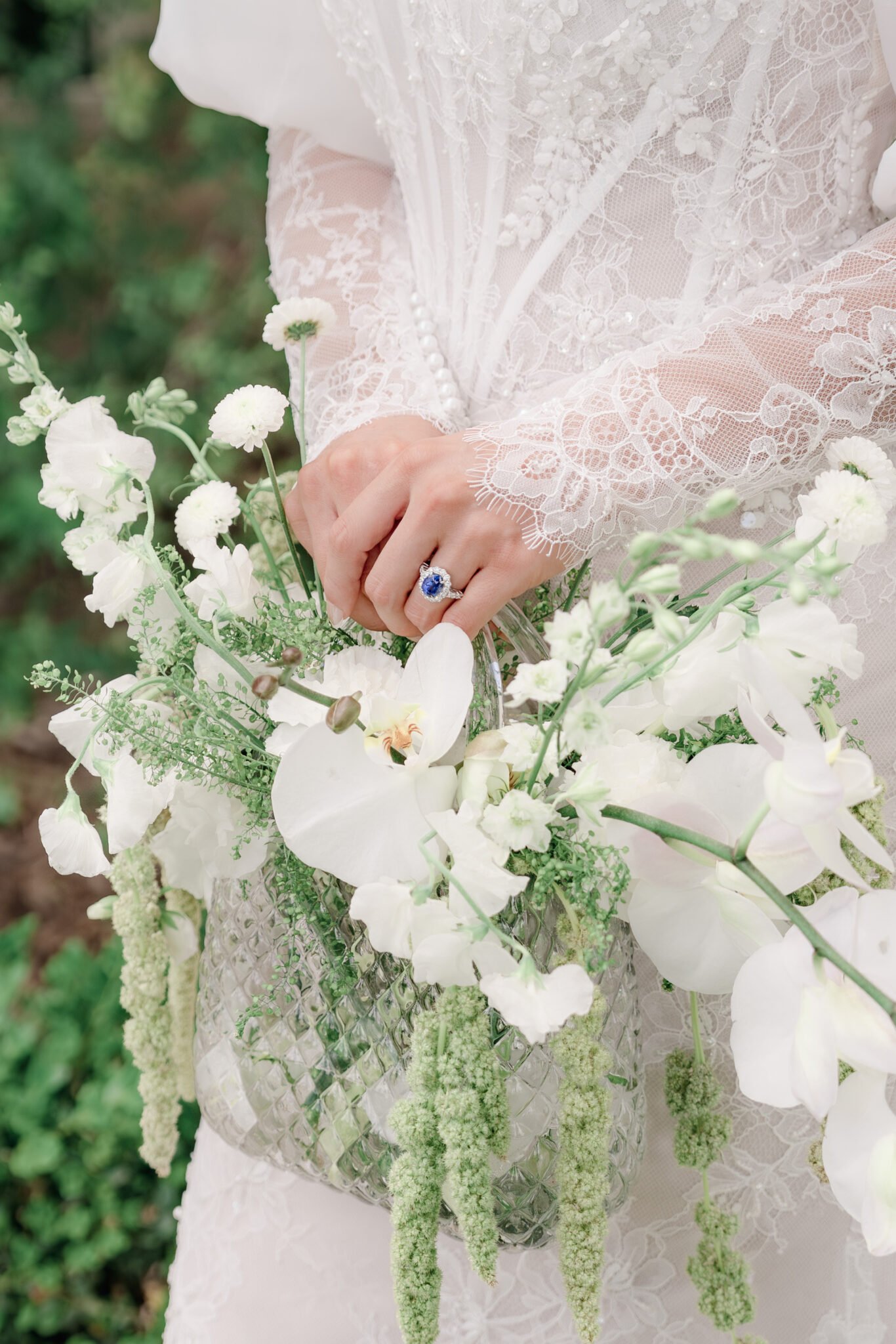 Fine Art wedding ring detail with vintage gold bands and heirloom diamond engagement ring on a soft velvet surface.